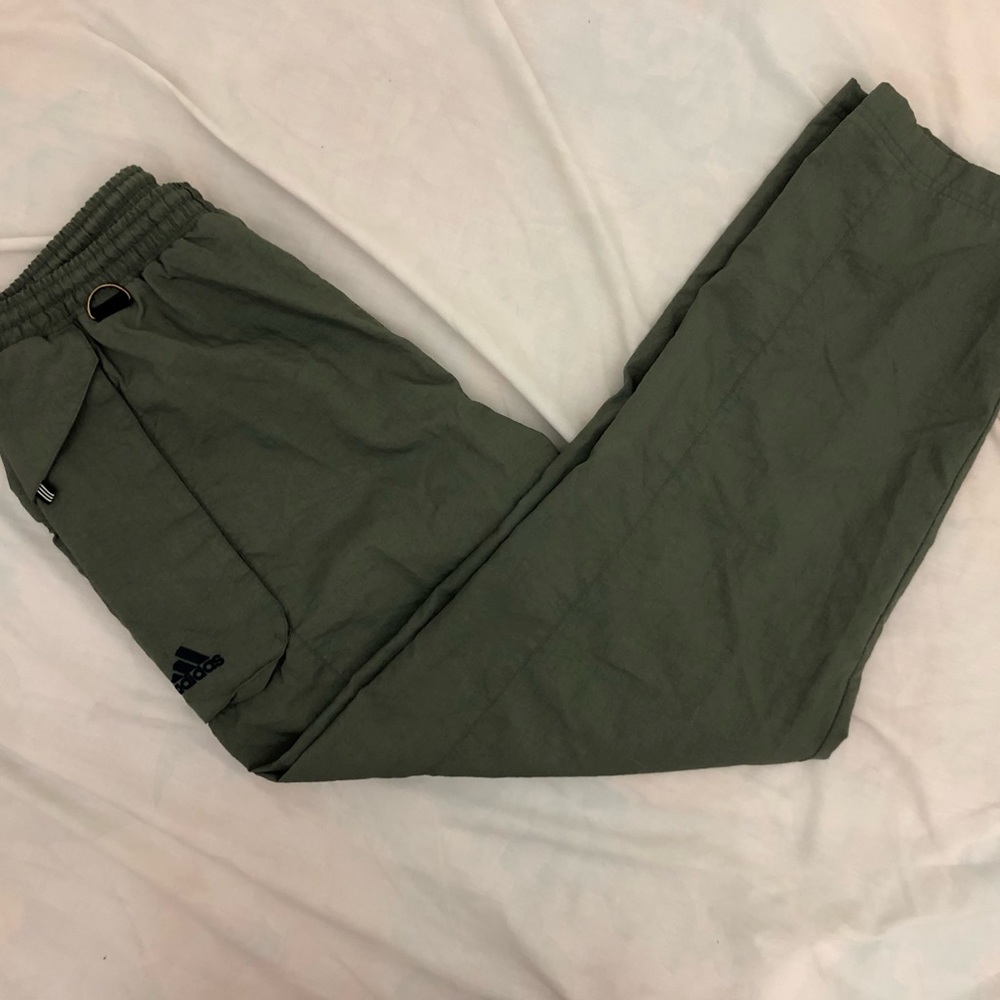 Navy green adidas track pants. Size mens M but dit more like an L.